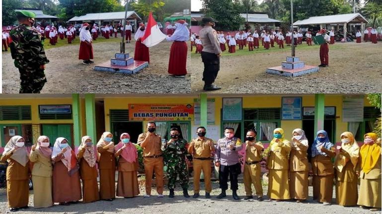 Anggota Babinsa dan Bhabinkamtibmas beri edukasi siswa SDN 04 Batang Tajongkek tentang pencegahan Covid-19 dan hal lainnya di sekolah tersebut, Senin pagi (8/2). (Dok : Istimewa)