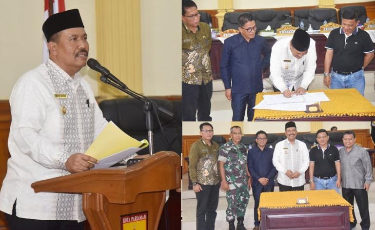 Wakil Wali Kota Pariaman, Mardison Mahyuddin saat tandatangani nota penetapan APBD perubahan di DPRD Kota Pariaman, Jumat sore (8/9). (Dok : Istimewa)