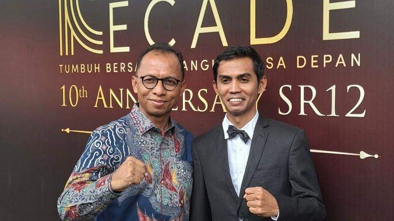 Direktur Keuangan Bank Nagari, Roni Edrian bersama President Director PT CMM Global Internasional Apt. Toni Firmansyah, S.Farm. IST